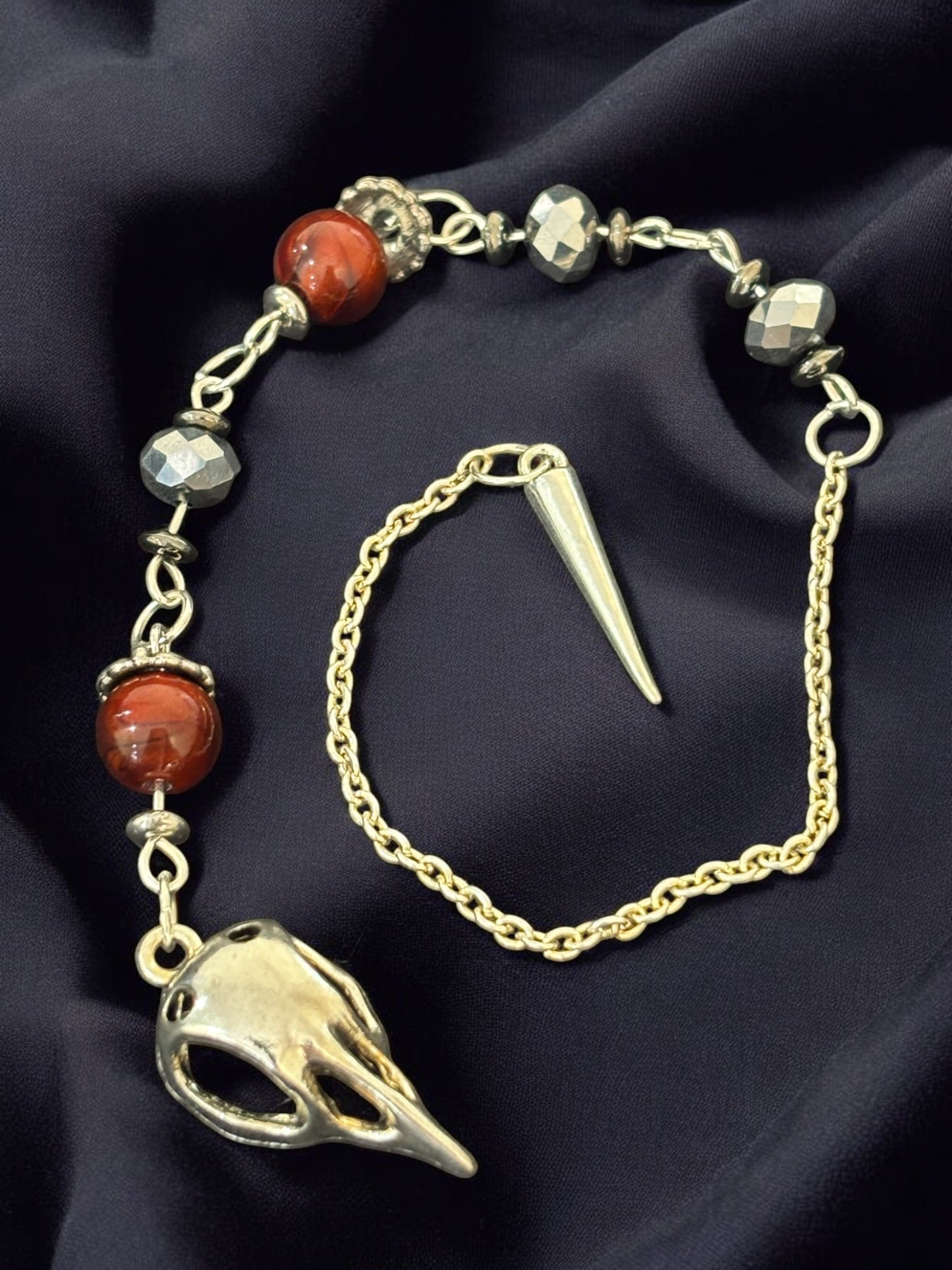 Raven Skull Pendulum with Red Beads